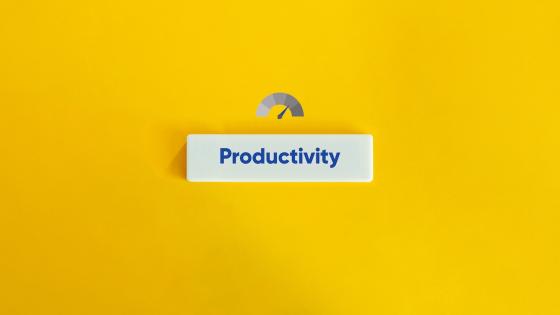 Dial measuring productivity on yellow background