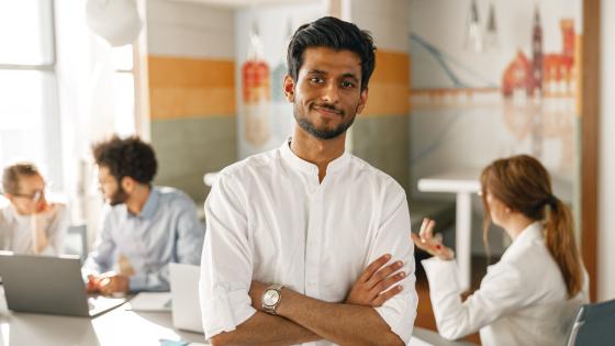 Young Indian worker in modern office