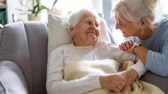 Woman caring for elderly mother