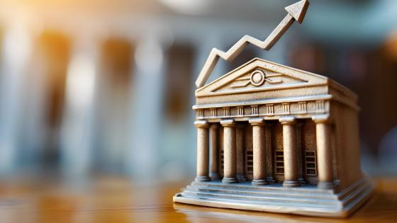Model of bank building with upward arrow